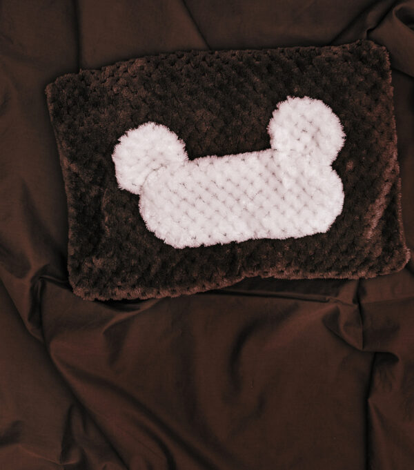 Brown and white textured cushion